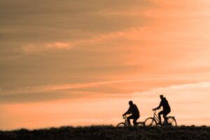cyclist slow travel sunset